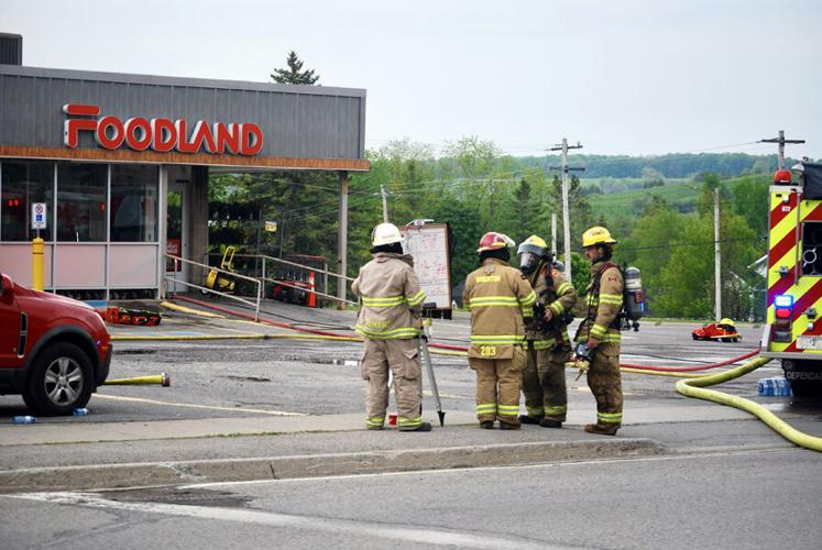 Firefighters in front of Colborne Foodland