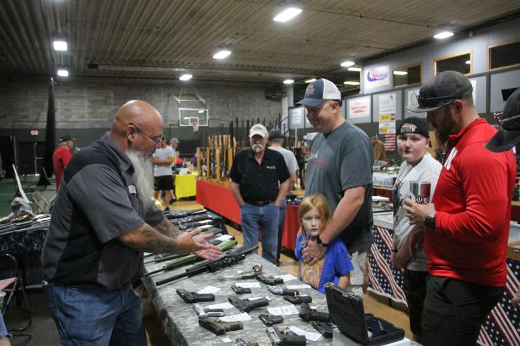 Sportsmen shop guns and knives at annual show