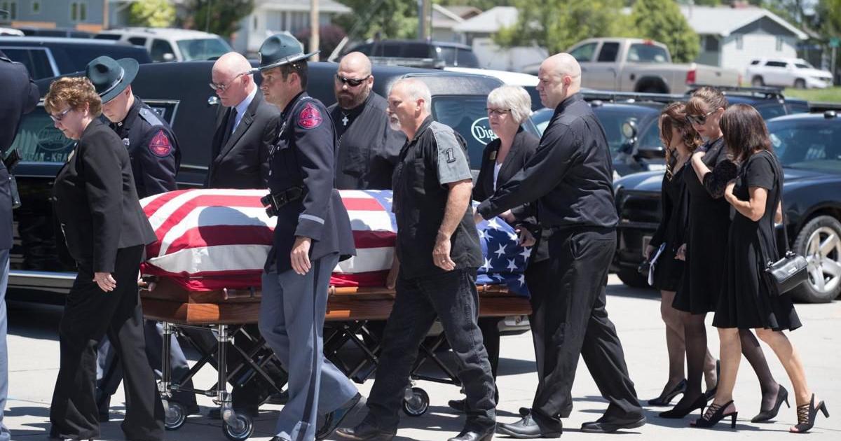 Law enforcement officers and the public honor Trooper Jerry Smith at