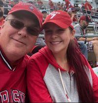 Police Chief Daniel Hudson and his daughter at the game.jpg