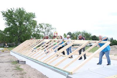 Volunteers raise Habitat house walls