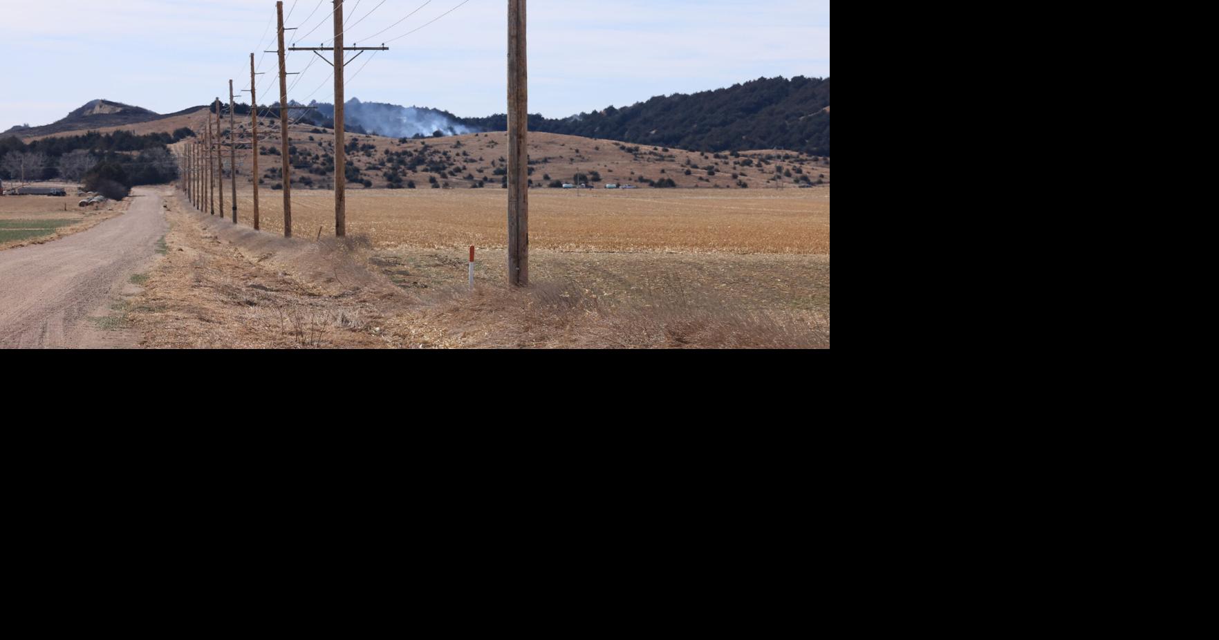 Winds calm, temperatures cool as firefighters' days-old battle ...
