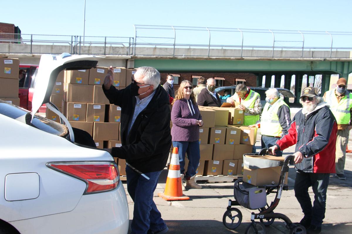 Watch now: North Platte Rotarians distribute 1,200 boxes of food