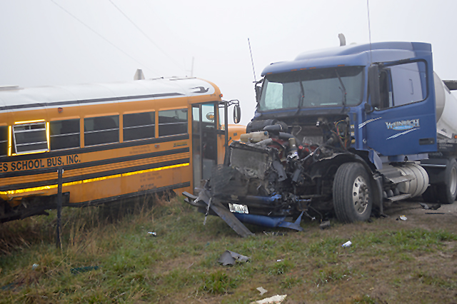 Students hurt when school bus and semi collide in fog