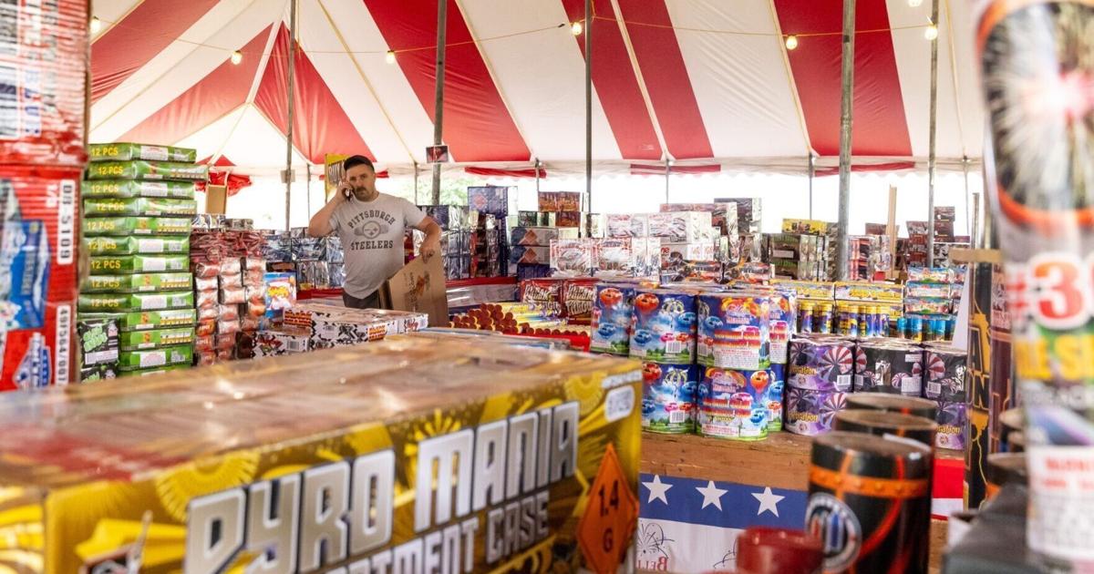 Photos: Employees prepare a Bellino Fireworks stand