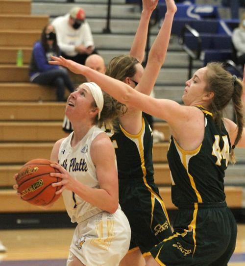 North Platte girls win close, boys fall against Kearney Catholic