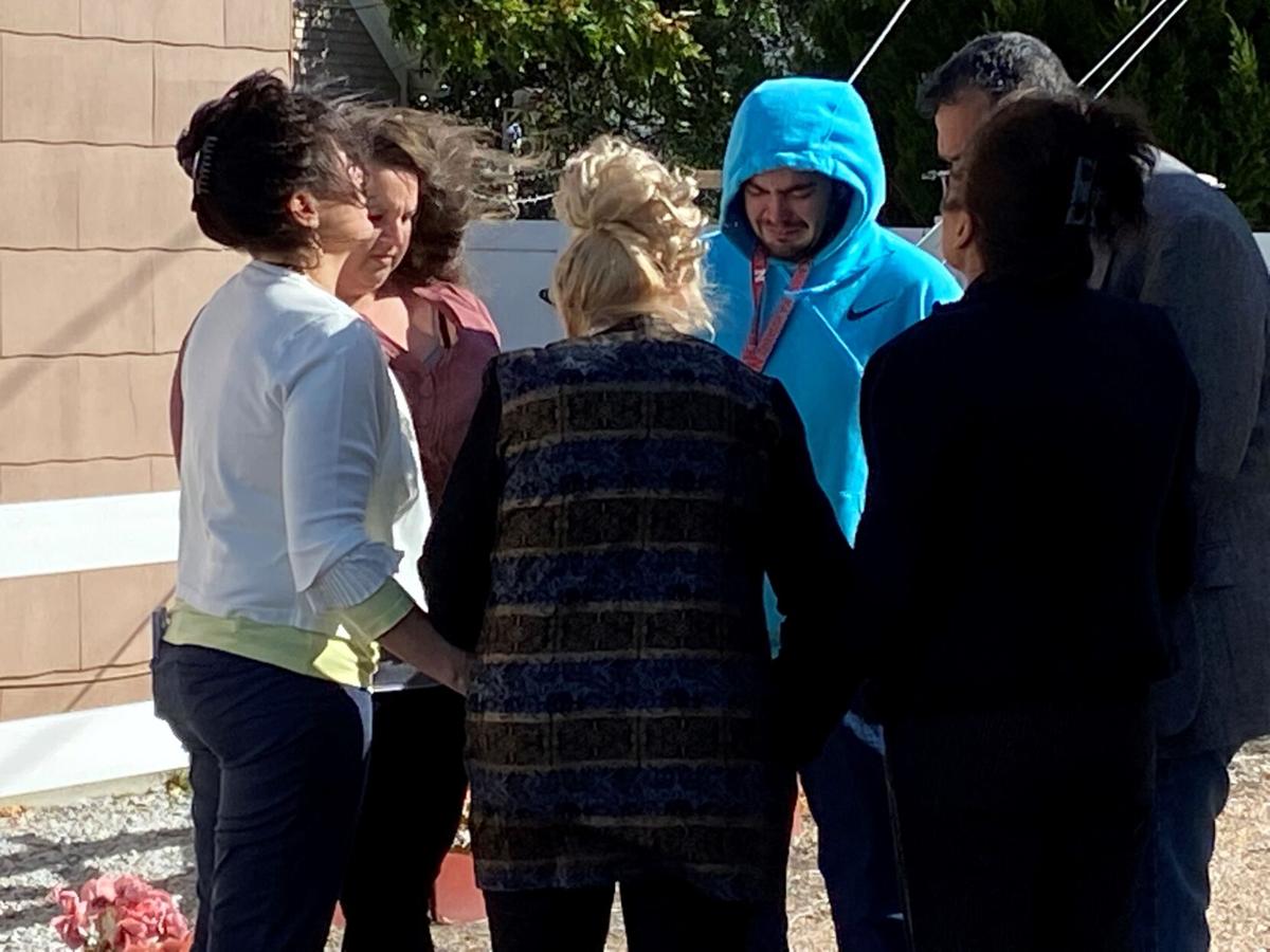 Family members pray in alleyway where Brett Torres was killed