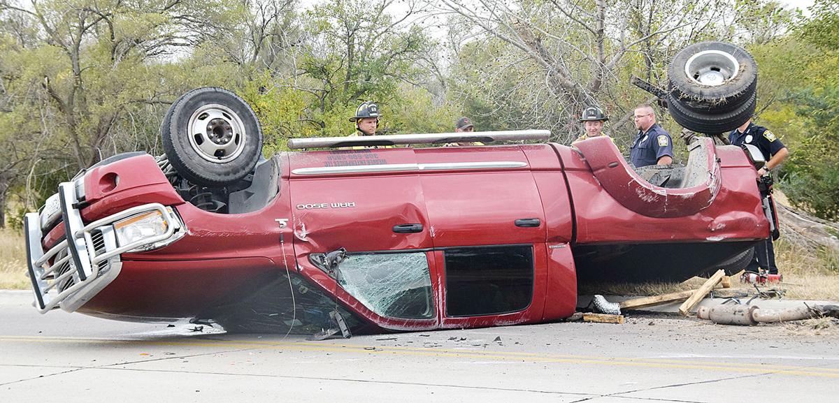 Collision flips truck