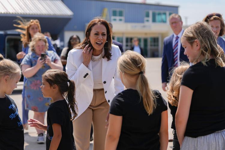 Harris and Vance cross paths on airport tarmac