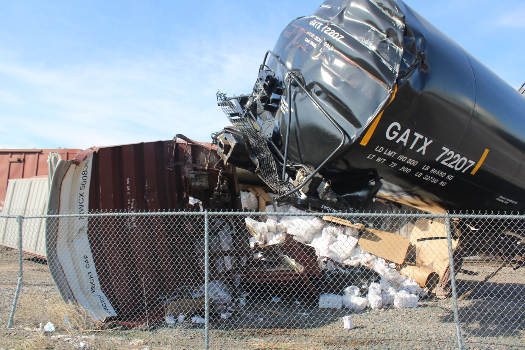 Auto Racks Derailment Downtown U.P. derailment rips open railcar full of sugar
