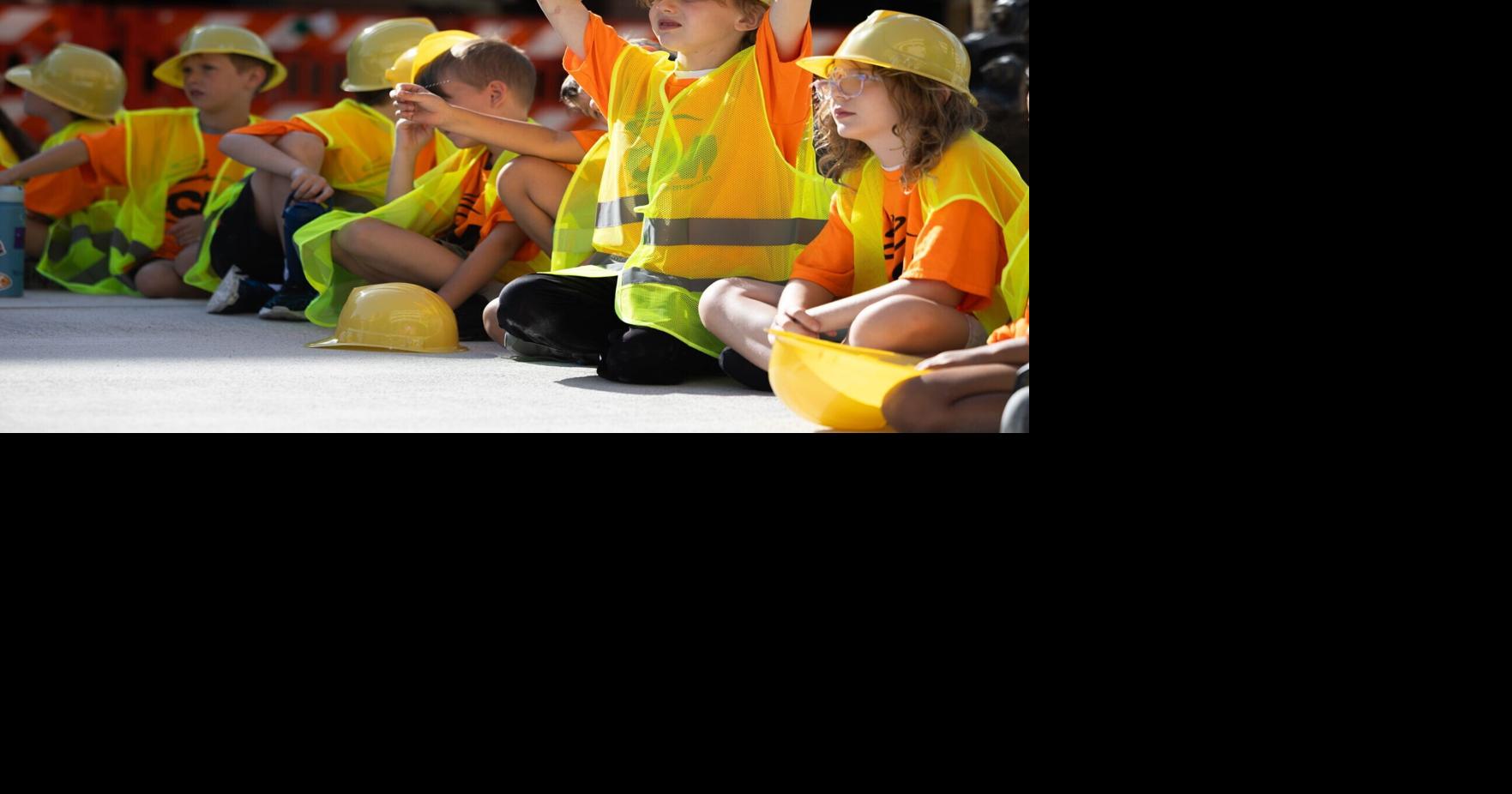 Hard hats, hard working kids get messy on O Street with mayor