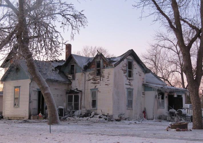 Service dog, neighbor credited with saving 3 lives after fire guts