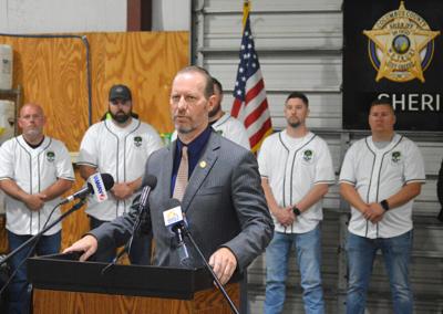 With the Columbus County Sheriff’s Office Drug Enforcement Unit behind him, District Attorney Jon David speaks to members of the media during a Friday morning press conference regarding the Dessie Road nuisance abatement. Staff photo by Thomas Sherrill ...