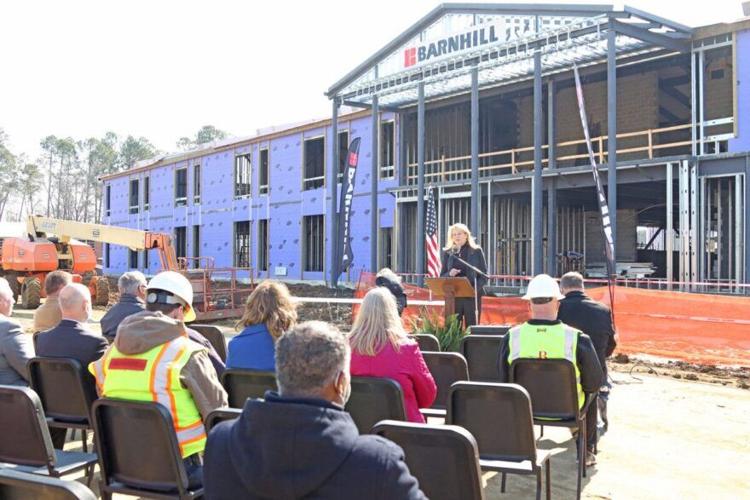 School leaders celebrate placement of final beam at West Columbus School Education
