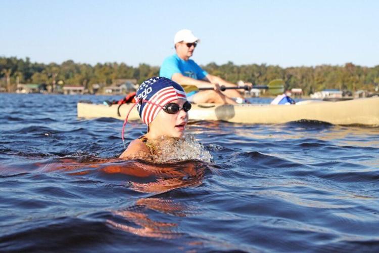 Swimmers traverse Lake Waccamaw on Labor Day Archives