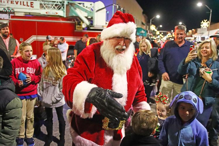 Santa arrives on firetruck to light downtown Whiteville Christmas tree