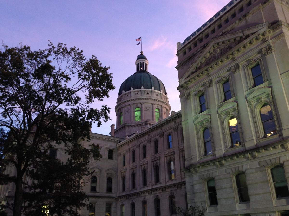 begins signing new laws as annual Indiana legislative session