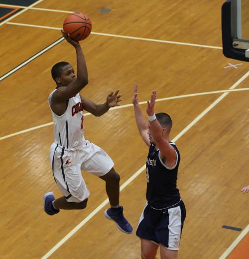 Boys Basketball West Side Pushes Past Marquette Catholic Late