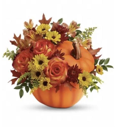 Fall flowers and accents make a festive statement on Thanksgiving table