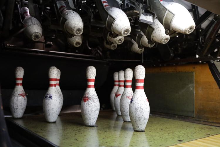 Manual scoring, vintage pinsetters keep bowling alley right at home