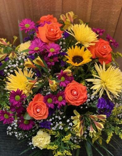 Fall flowers and accents make a festive statement on Thanksgiving table