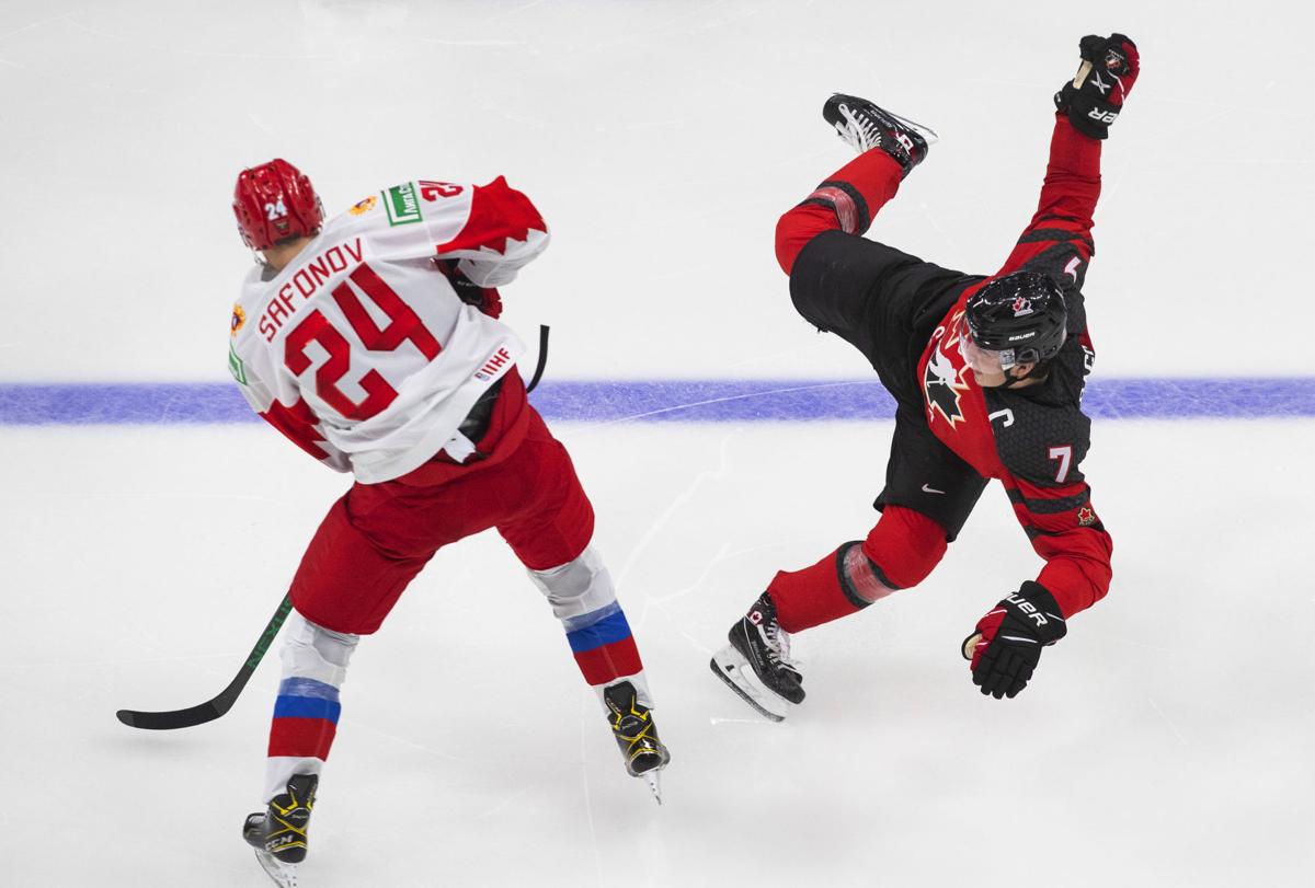 Chicago Blackhawks center Kirby Dach, right, celebrates his tying