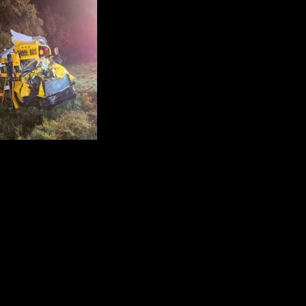 Bus driver pinned for hours after colliding with truck