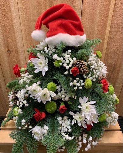Florists start with the green and add the feelings to create holiday magic