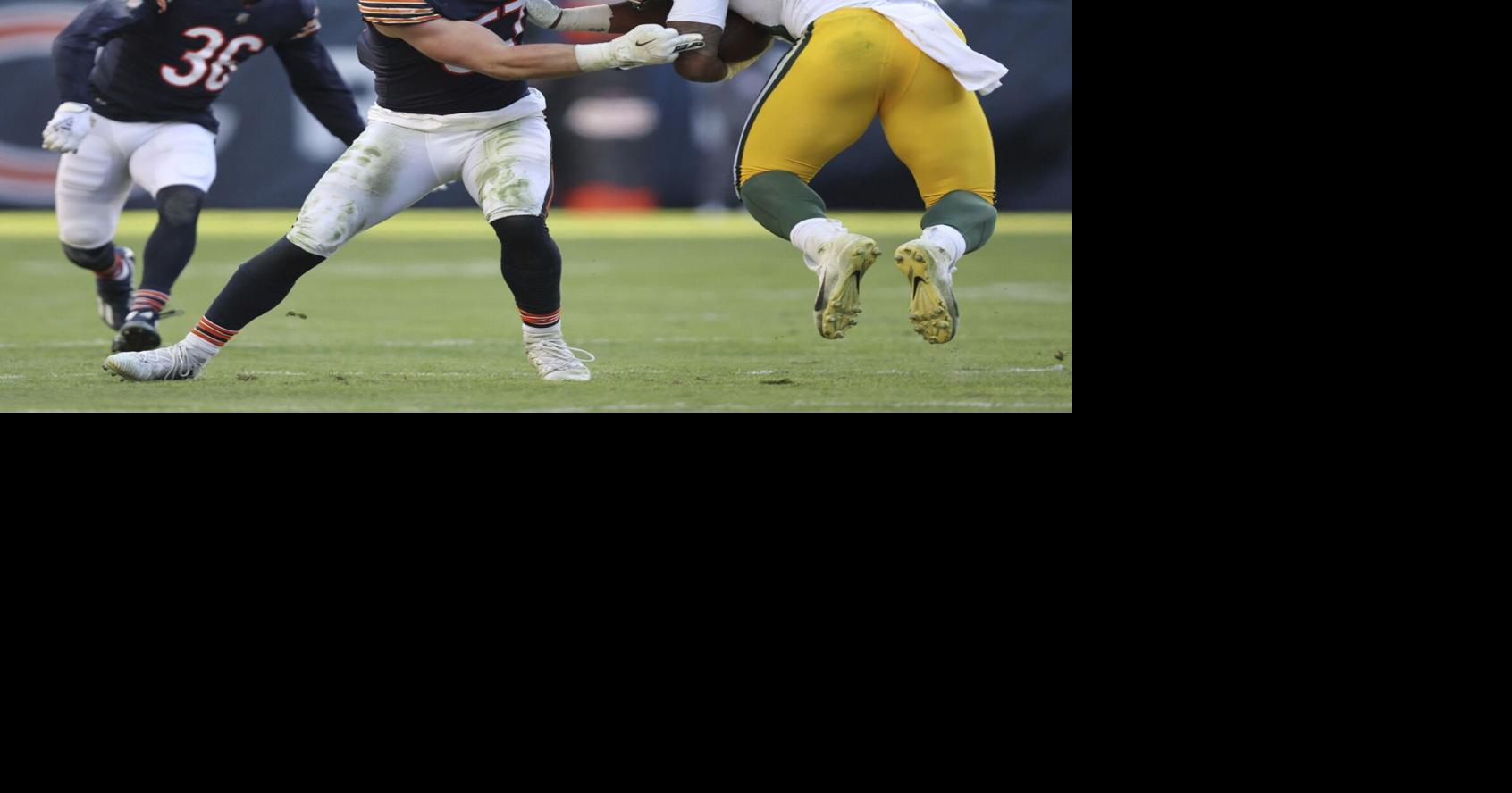 Chicago Bears linebacker Jack Sanborn (57) runs after the ball