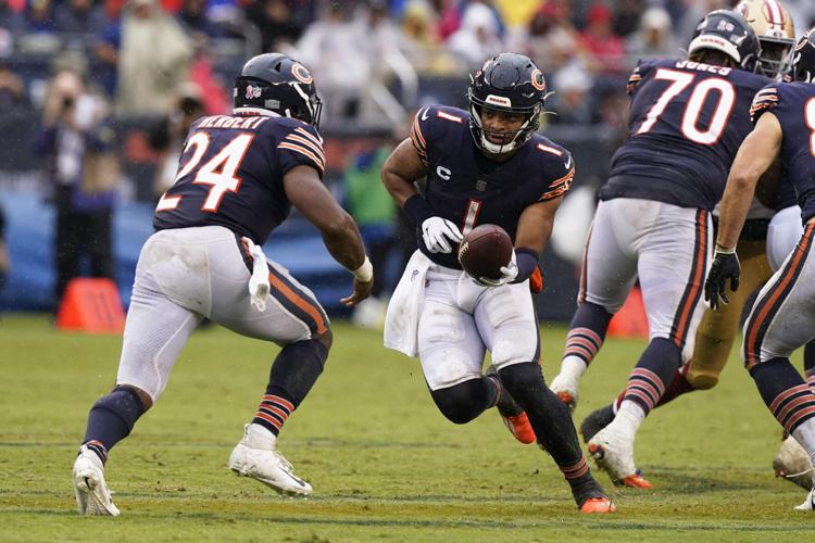 Justin Fields' belly flop on rain-soaked field a fitting capper for Bears'  upset