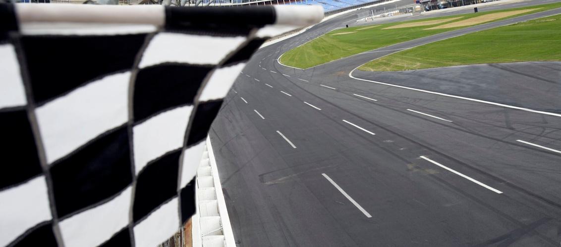 Checkered flag and motor speedway