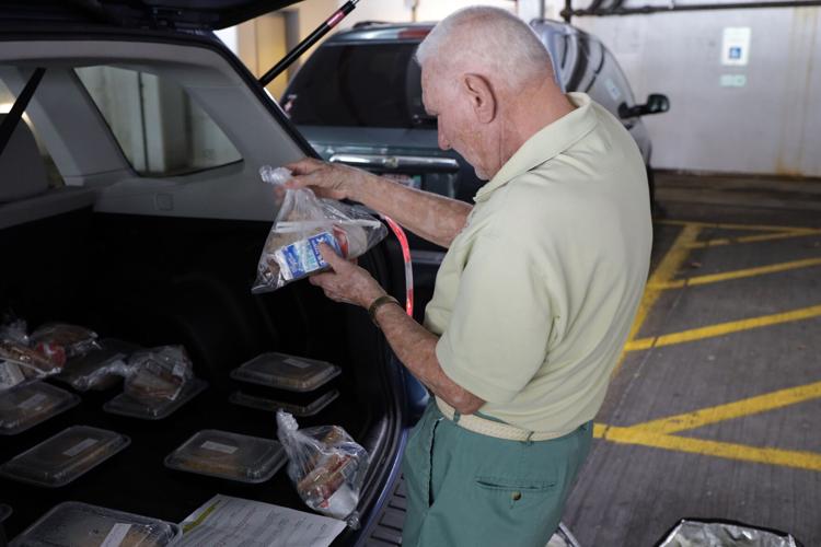 Palos Hospital volunteers serve a side of kindness with the meals they deliver