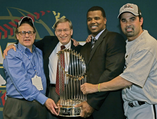 Chicago White Sox manager Ozzie Guillen hoists the World Series trophy  after beating the Houston Astros 1-0 in game 4 of the World Series, October  26, 2005 in Houston, TX. The White