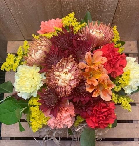 Fall flowers and accents make a festive statement on Thanksgiving table