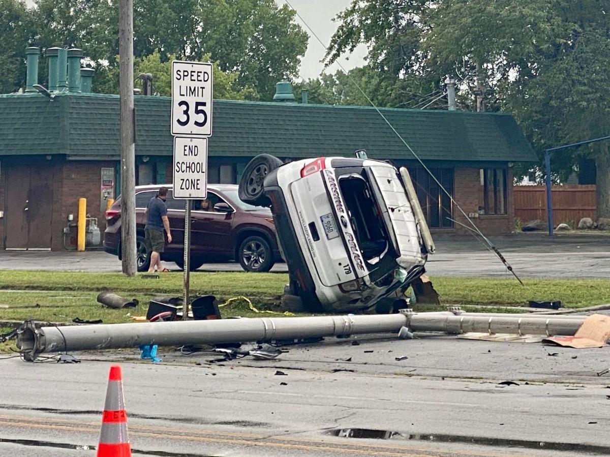 Squad car involved in rollover crash while responding to wreck