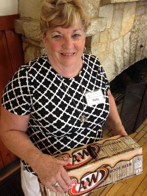 Kathy Flory-Smith Holding her Key Ingredient for Root Beer Ribs