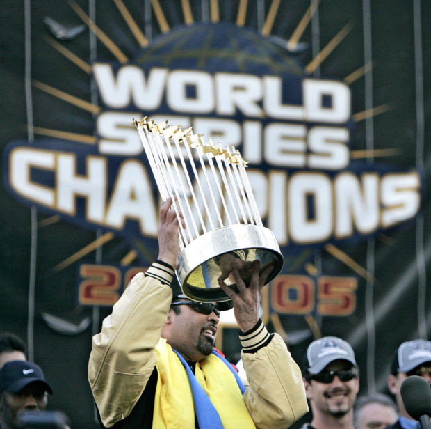 Chicago White Sox's Jermaine Dye holds up the World Series trophy after the White  Sox defeated the Houston Astros in Game 4 to win the World Series for the  first time since