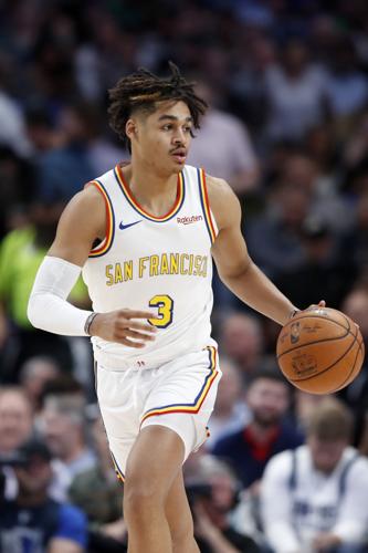 Golden State Warriors guard Jordan Poole throws out the ceremonial first  pitch before a baseball game between the San Francisco Giants and Atlanta  Braves, Sunday, Sept. 19, 2021, in San Francisco. (AP