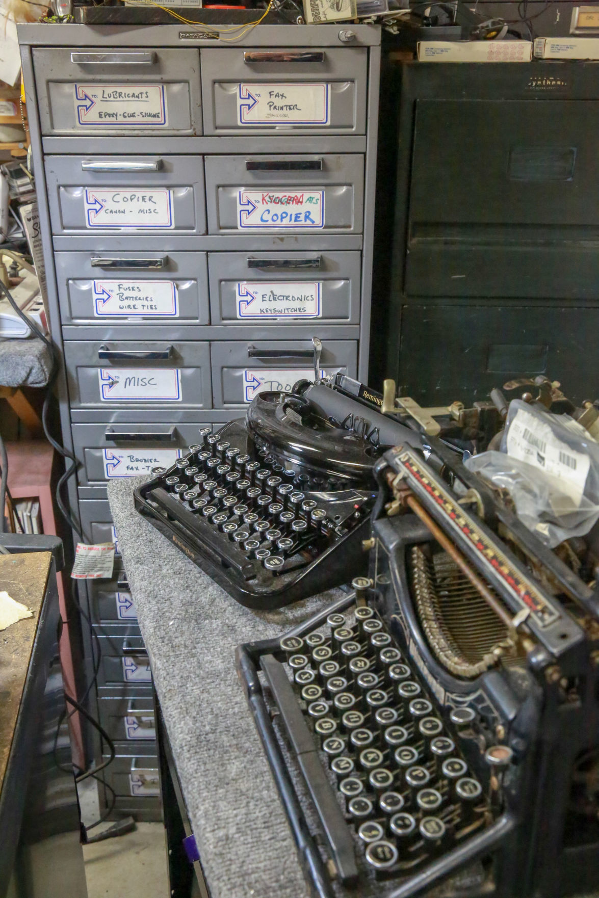 Last of their type Clock, typewriter repair shop owners, blacksmith