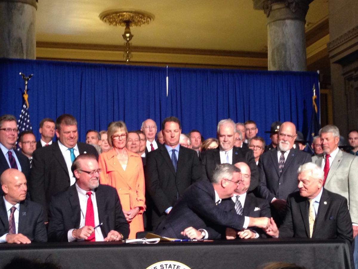 Holcomb approves tax hikes to fund massive road construction program