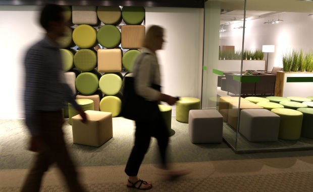Tear down that cubicle wall, office furniture designers say