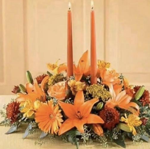 Fall flowers and accents make a festive statement on Thanksgiving table