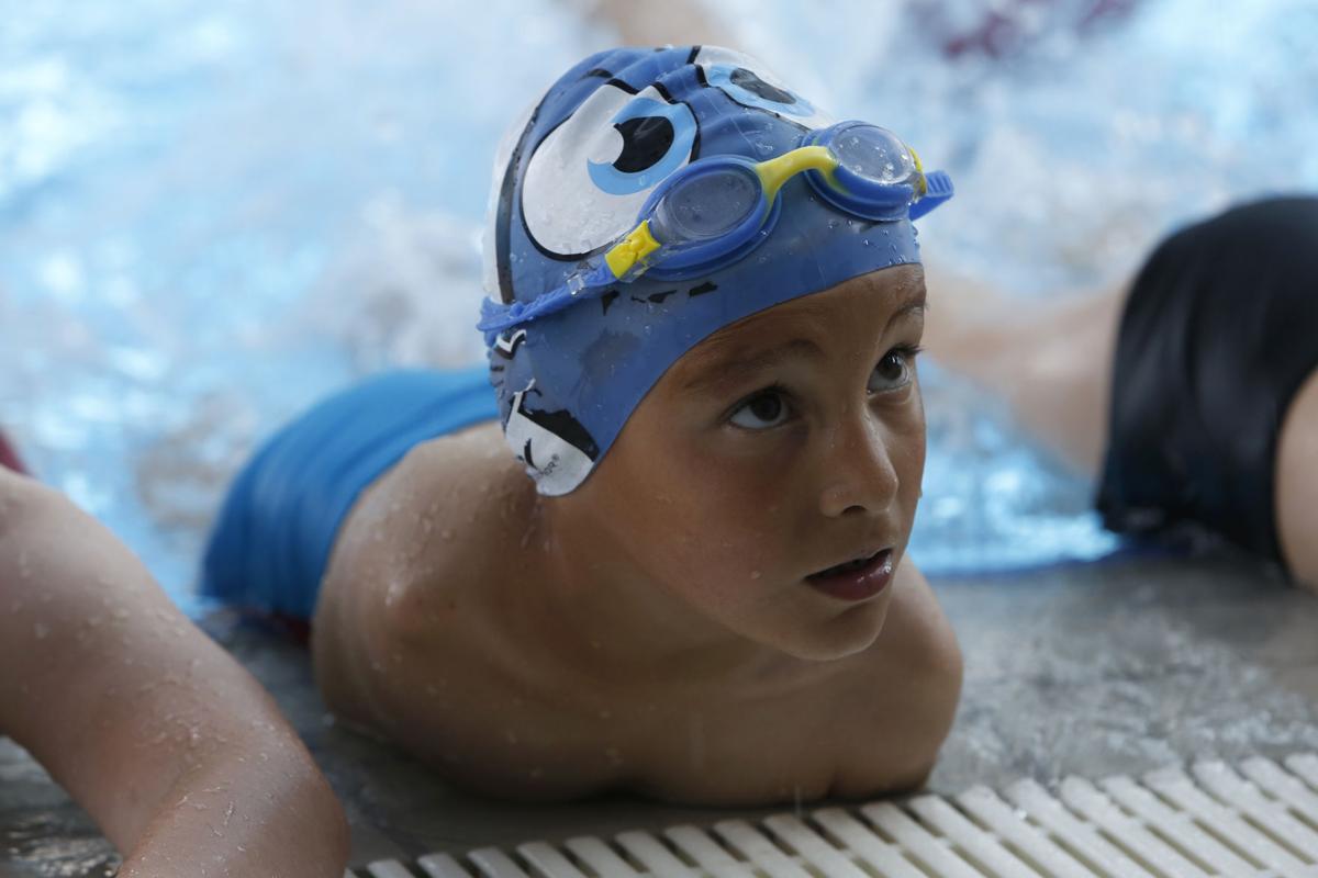 Photos He was born without arms. Now, he's a swimming champion Digital Exclusives Photo