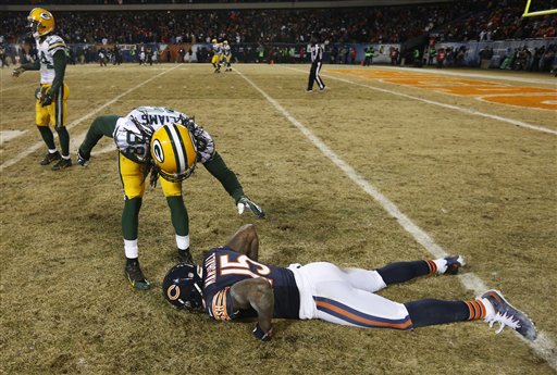 Chicago Bears wide receiver Devin Hester (23) celebrates with teammate  Corey Wootton (98) after scoring on an 89-yard punt-return in the fourth  quarter against the Seattle Seahawks of an NFL football game