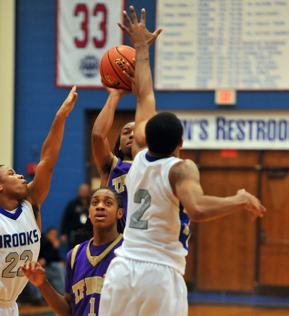 T.F. North s Armani Stephens shoots over Brooks Justin Rabb