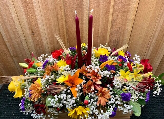 Fall flowers and accents make a festive statement on Thanksgiving table
