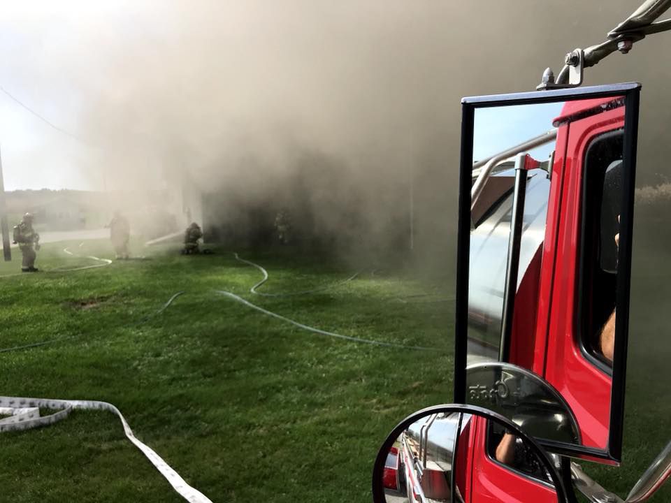 Firefighters fight flames in 90 degree weather in Winfield house fire
