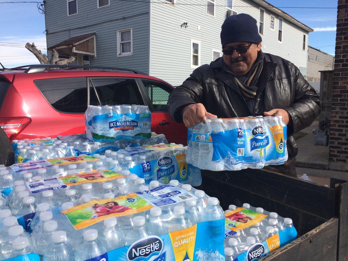 Volunteers deliver safe drinking water to Superfund residents