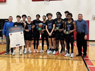 Lincoln-Way East boys and girls again claim basketball tourney titles
