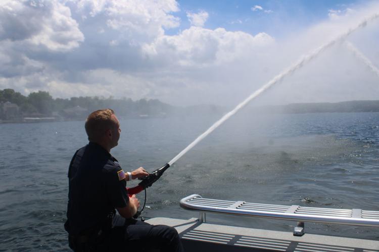 Watch: Firefighters use water jetpacks to put out flames